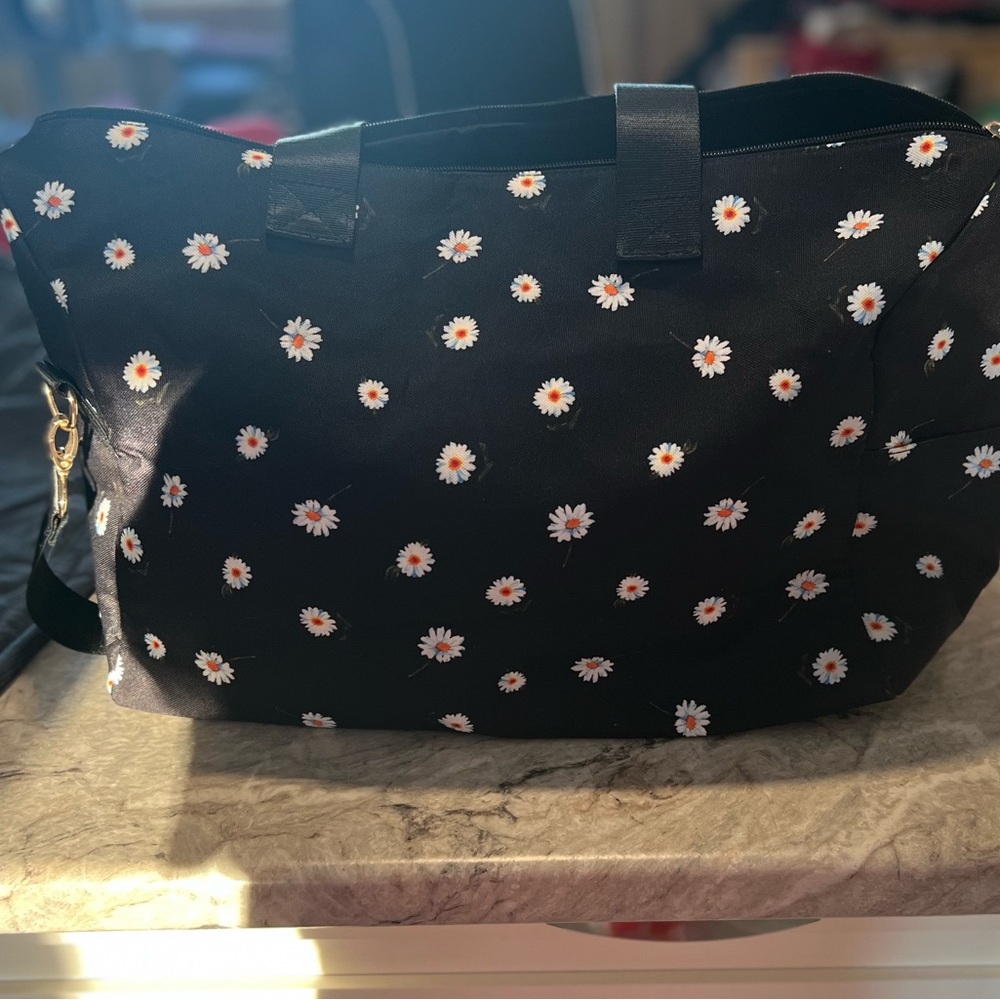 Women’s Alice and Olivia duffle bag. 20.00